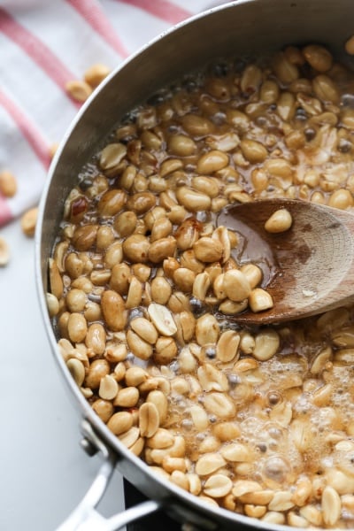 stirring peanut mixture in pan