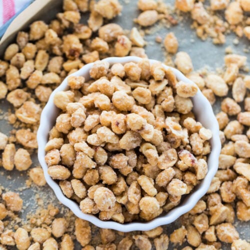 candied sugar peanuts in a bowl, sitting on a baking sheet