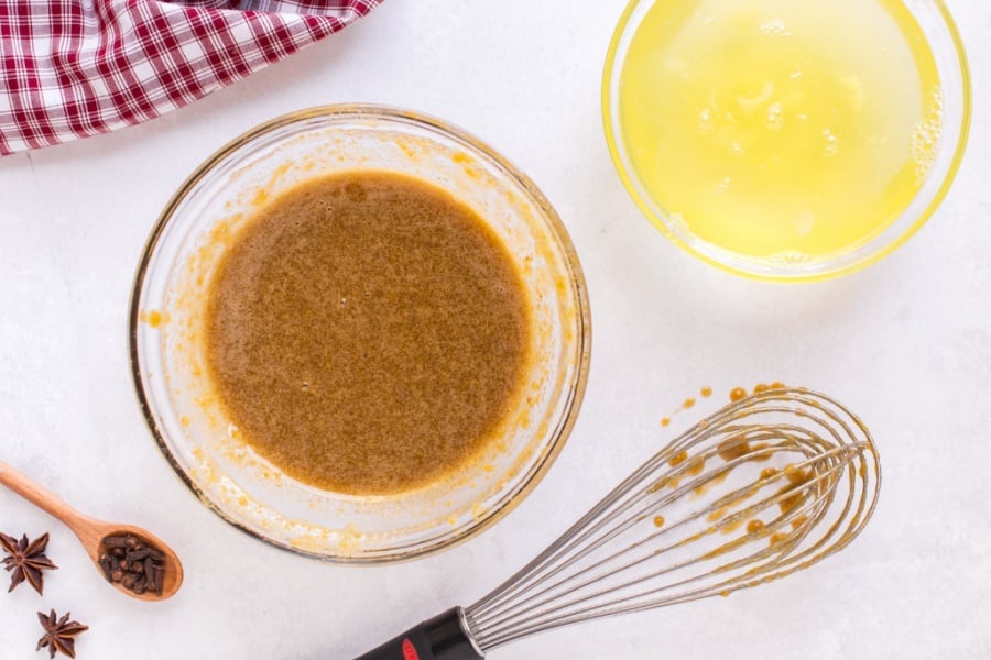 egg yolks and sugar mixed in a glass bowl