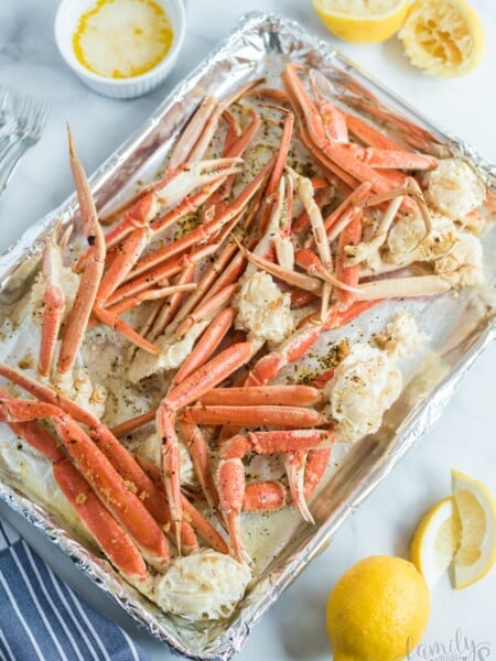 crab leg clusters on a baking sheet
