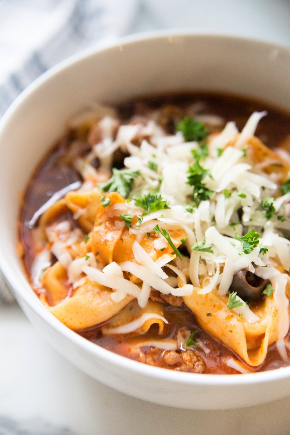 pizza soup in a white bowl