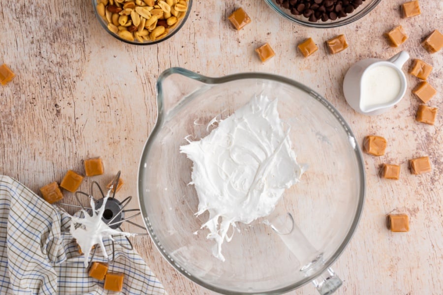 egg whites and salt mixed into a white foam in mixing bowl