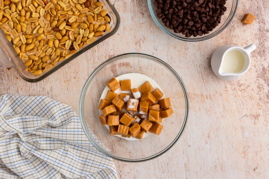 caramel cubes and milk in a glass bowl