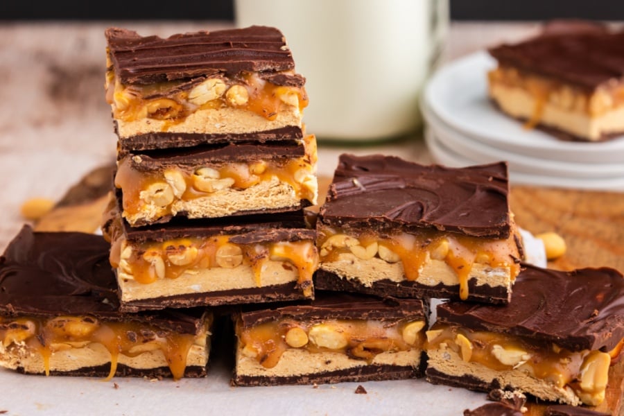 homemade snickers bars stacked on table