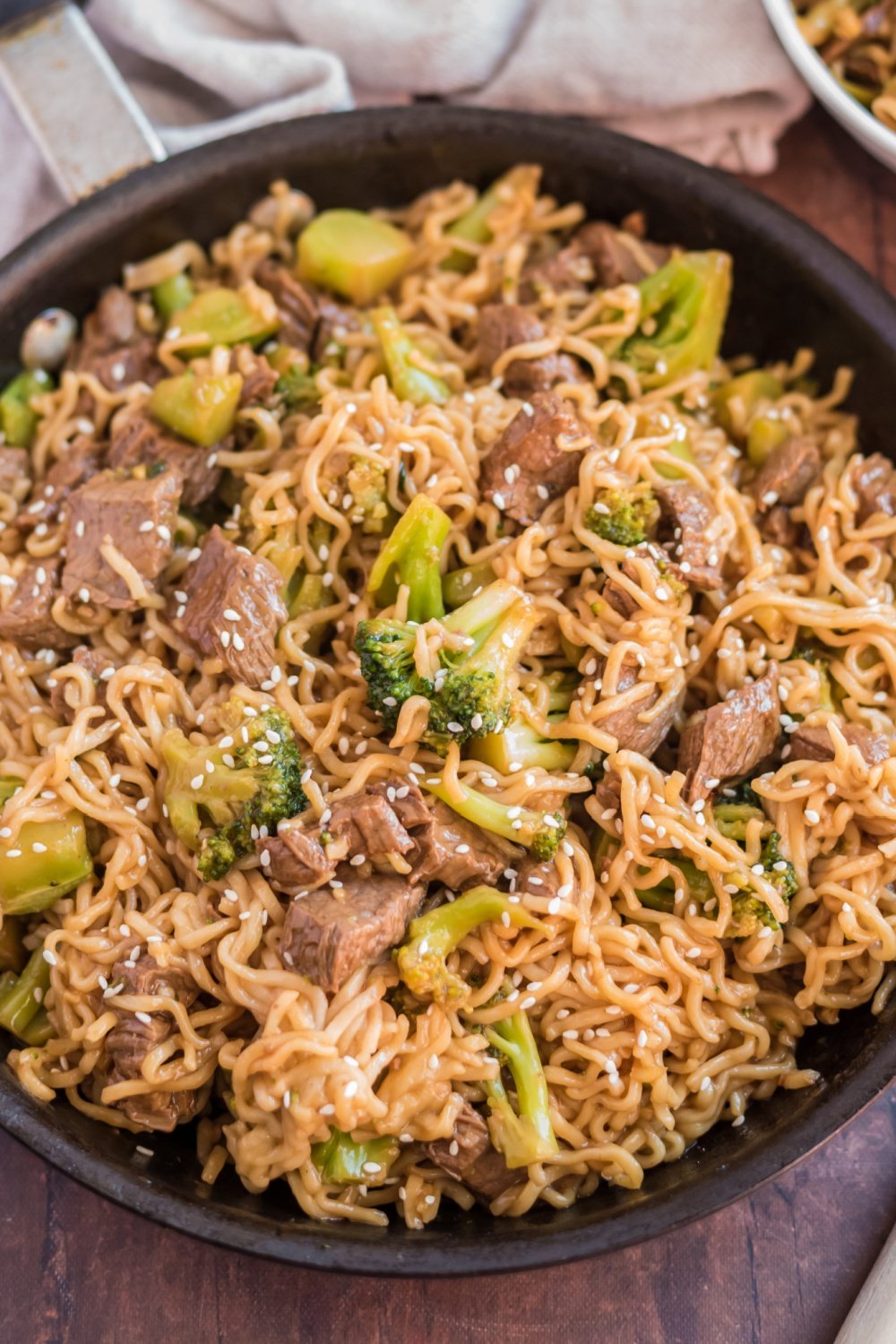 Take-Out Beef and Broccoli Ramen Noodles in a cast iron pan