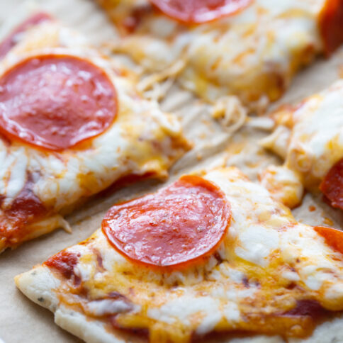 small pepperoni pizza cut into fourths