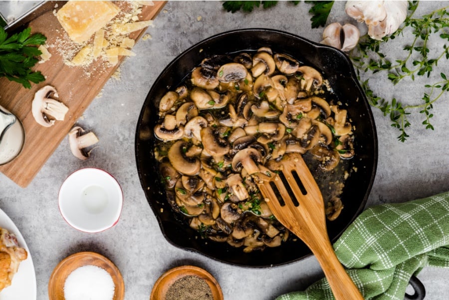 mushrooms cooking in cast iron pan