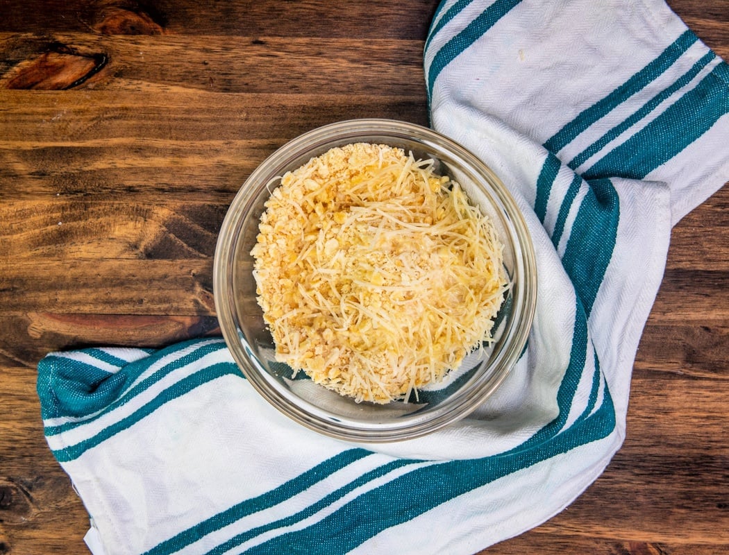 crushed crackers, parmesan cheese in a small mixing bowl