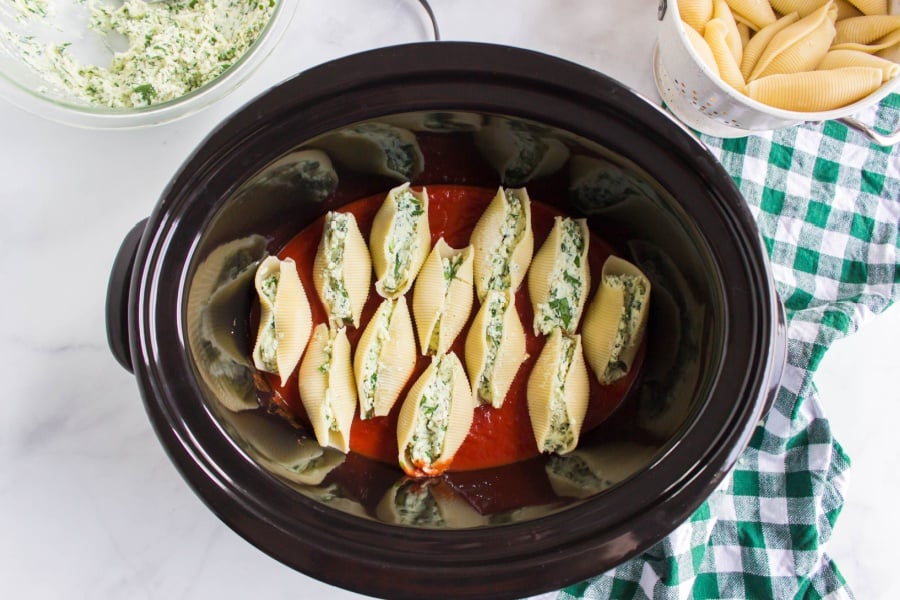 stuffed shells place in crockpot on top of red sauce