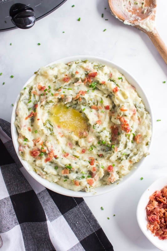 Crockpot Colcannon Potatoes are a traditional Irish dish of mashed potatoes mixed with greens, milk and butter and bacon! via @familyfresh