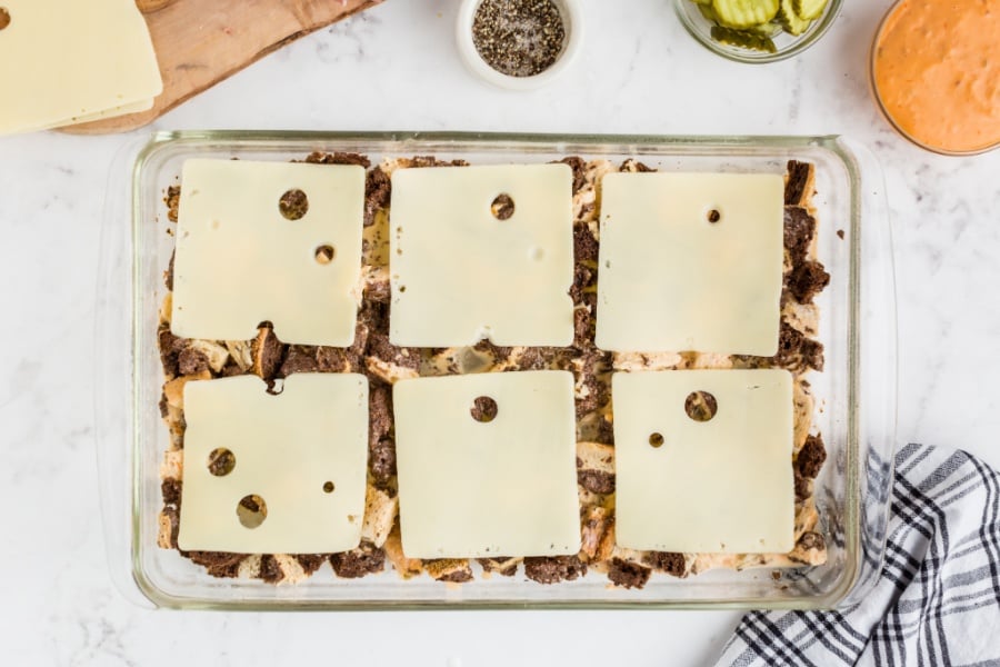 slices of Swiss cheese placed on top of bread