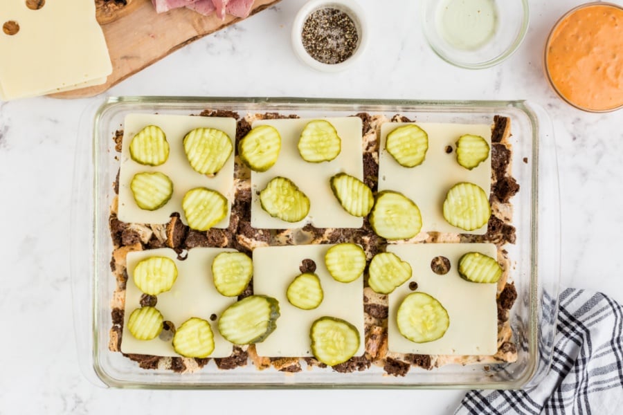 pickle slices placed on top of cheese