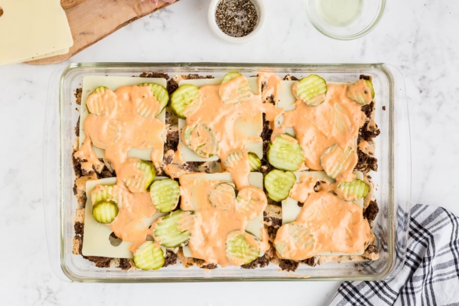 dressing spread on top of pickle layer