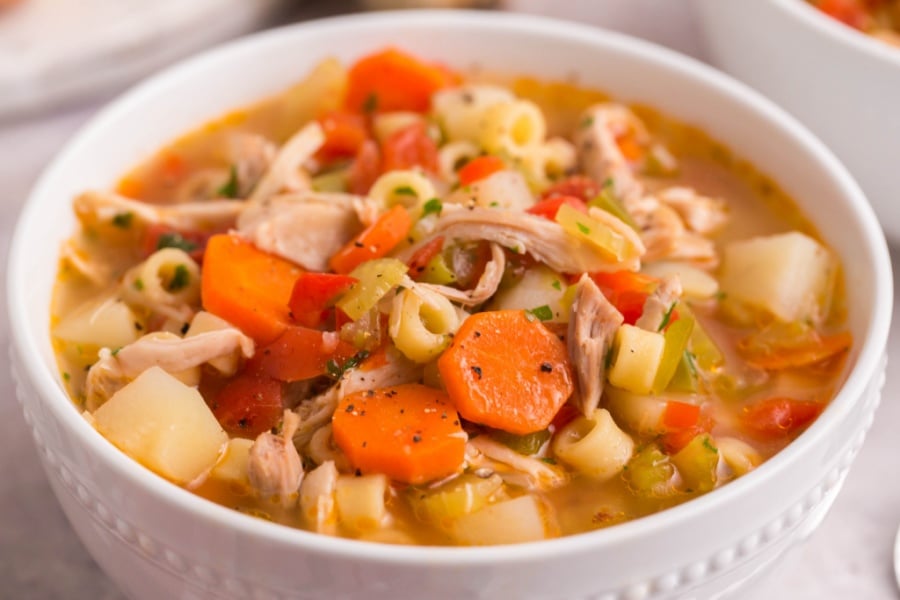 Sicilian Chicken Noodle Soup in a white bowl