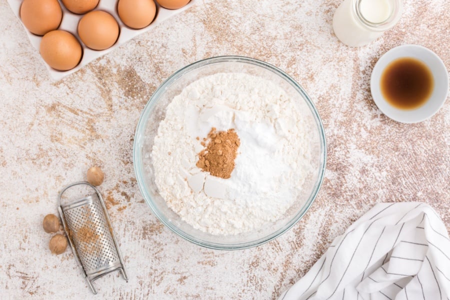 flour, baking powder, baking soda, salt, and nutmeg in a mixing bowl