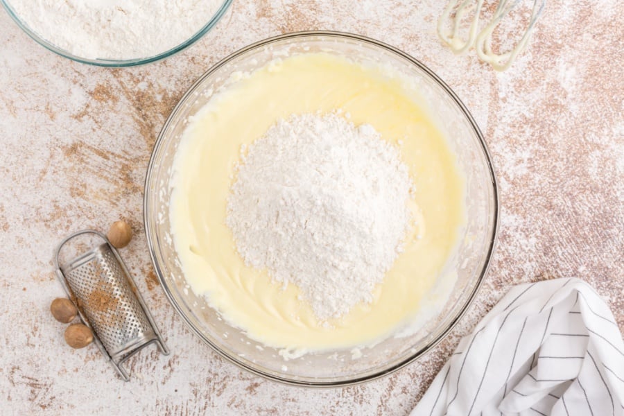 flour being added to mixing bowl