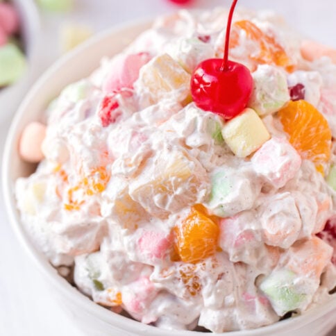 Ambrosia Salad in a white serving bowl