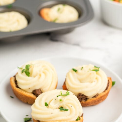 3 mini shepherd pies on a white plate