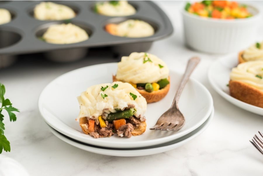 2 mini shepherd pies on a white plate