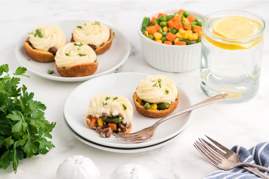 2 mini shepherd pies on a white plate