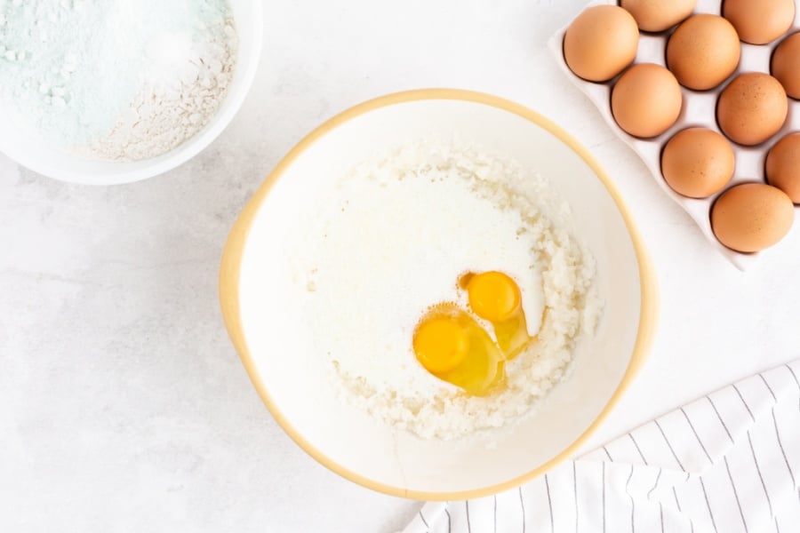 vegetable oil, sugar, eggs, almond extract, and milk in a mixing bowl