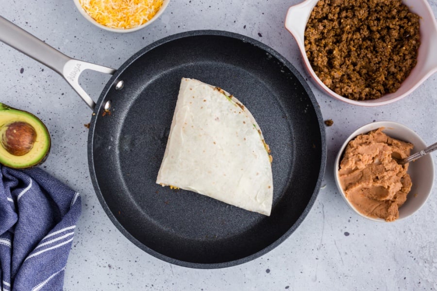 quesadilla cooking in frying pan