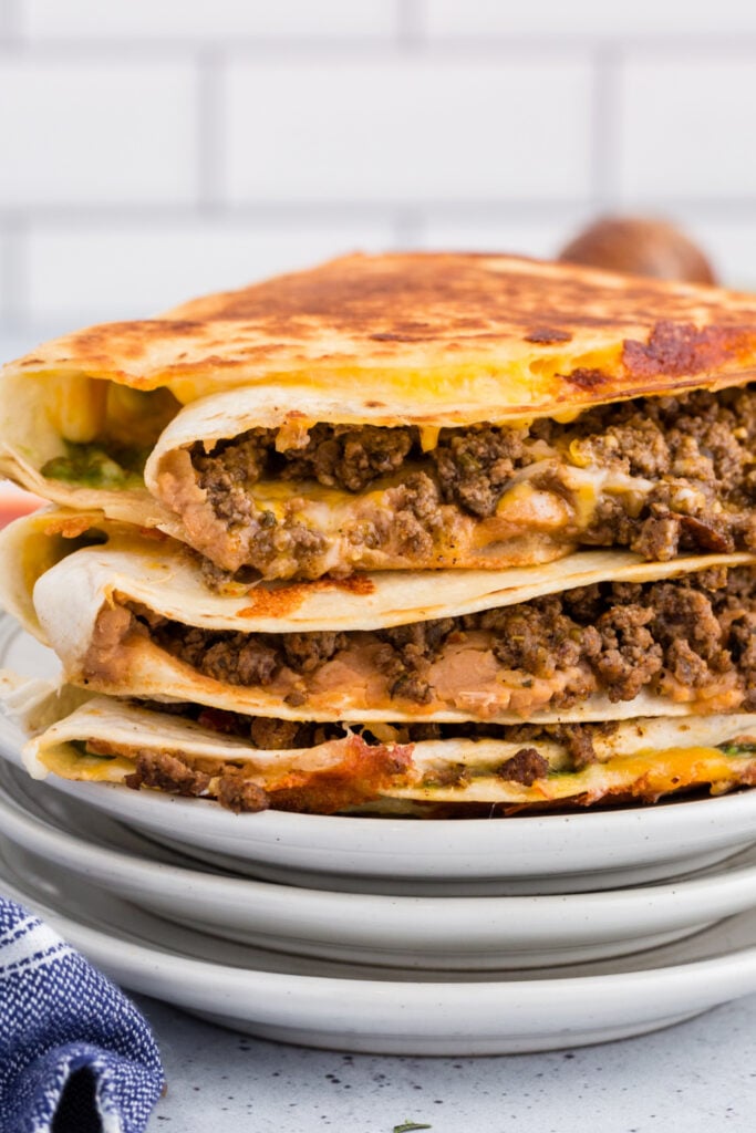 stack of quesadillas on plates