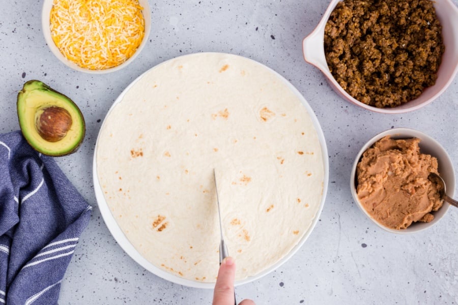 knife cutting tortilla