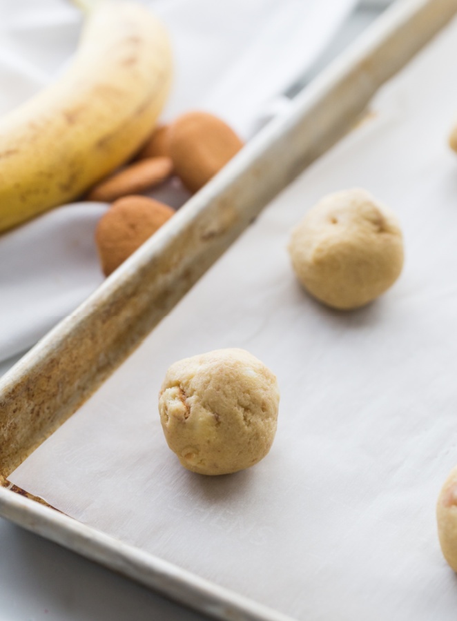 cookie dough balls on a baking sheet