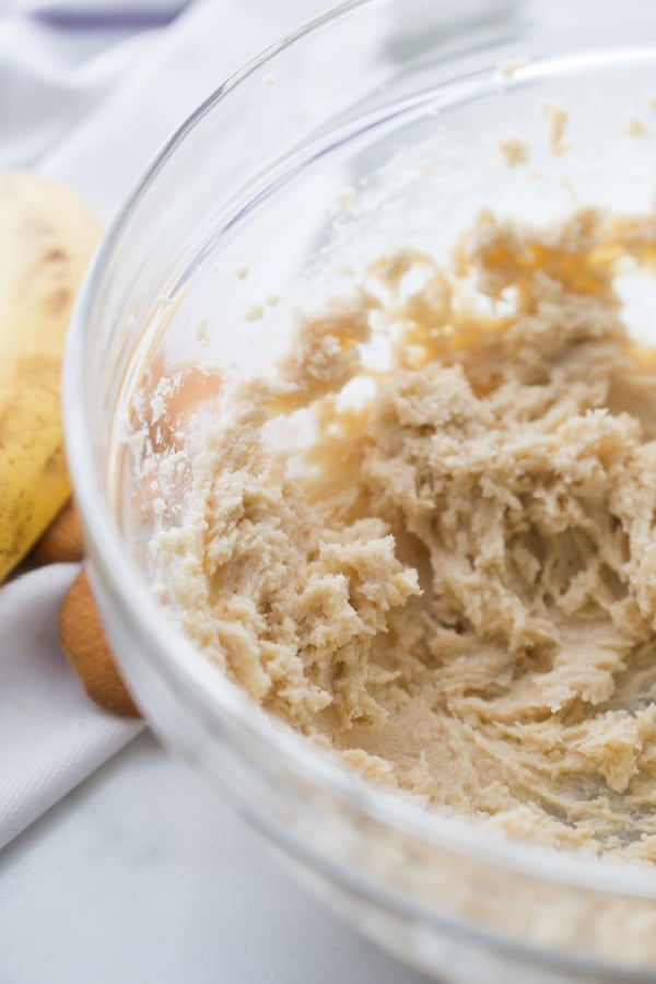 butter, brown sugar, granulated sugar, eggs and vanilla mixed in a glass bowl