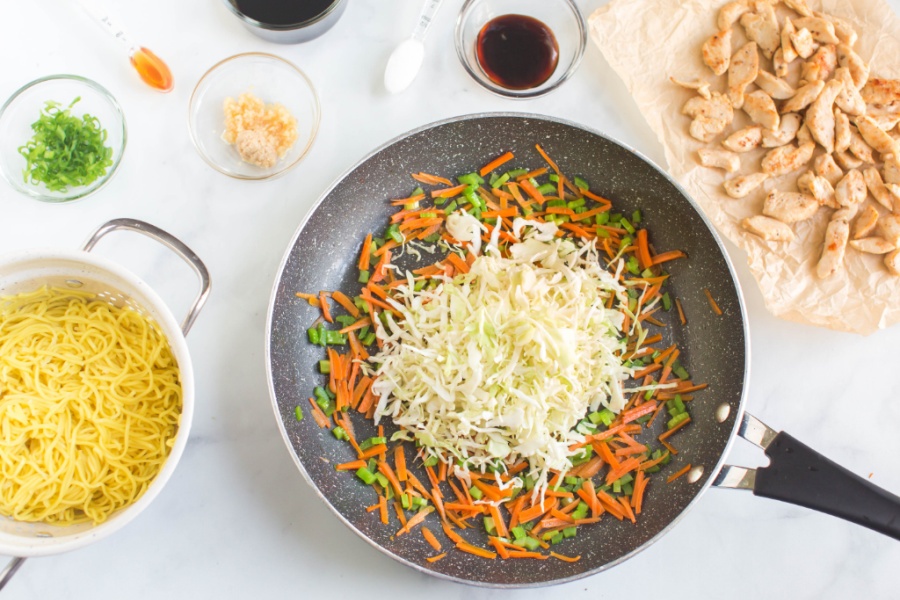 shredded vegetables cooking in pan