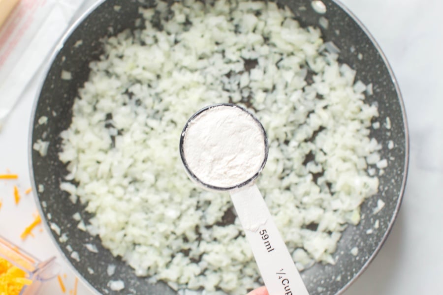 tablespoon of flour over a pan of onions