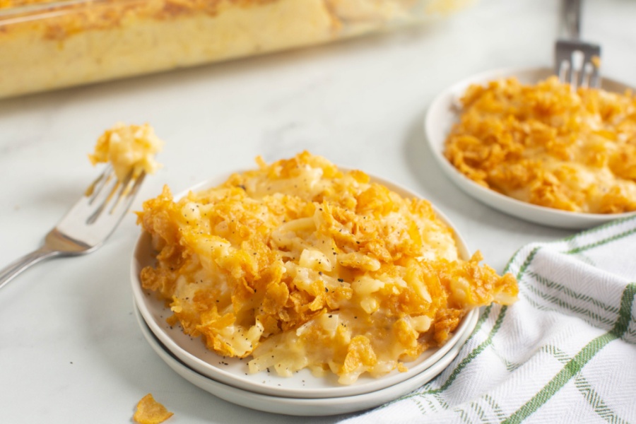 two plates of Classic Cheesy Funeral Potatoes