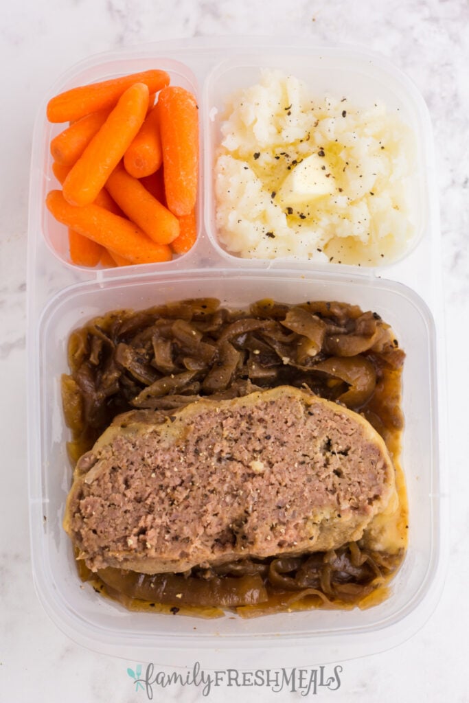 meatloaf, potatoes and carrots packed in a lunchbox