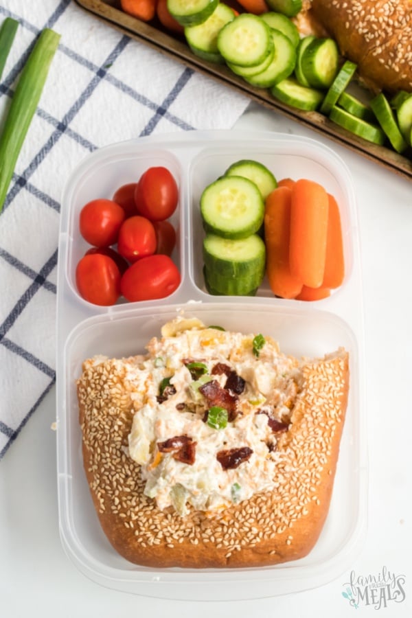 dip packed in a lunchbox with vegetables