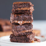 Nutella Stuffed Brownies stacked on a plate