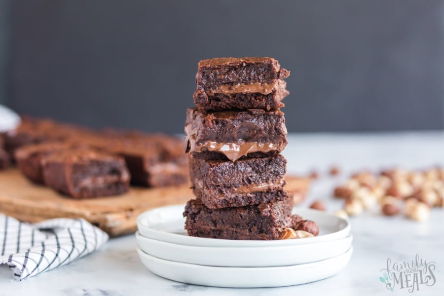 Nutella Stuffed Brownies stacked on a plate