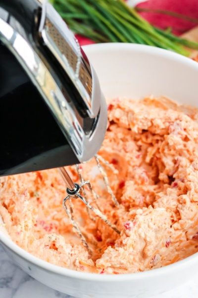 hand mixer mixing pimento cheese spread