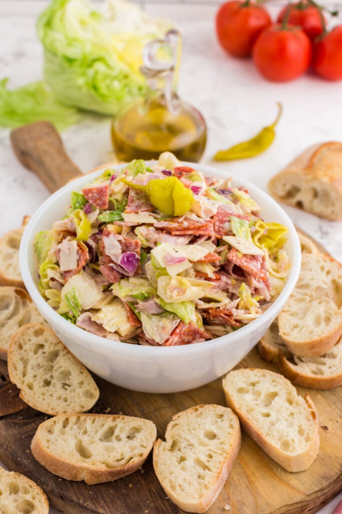 Italian Hoagie Dip in a bowl with sliced baguettes 