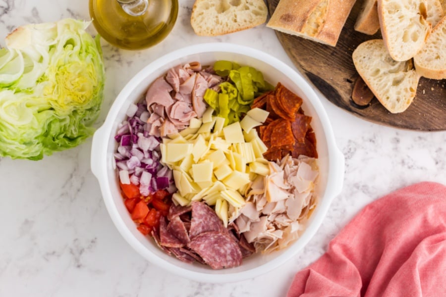 diced meats, cheese and veggies in a large mixing bowl