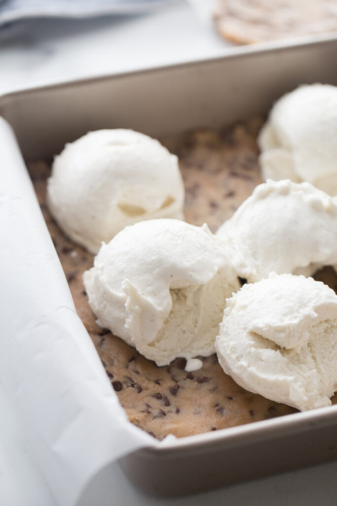 ice cream scoops placed on top of dough