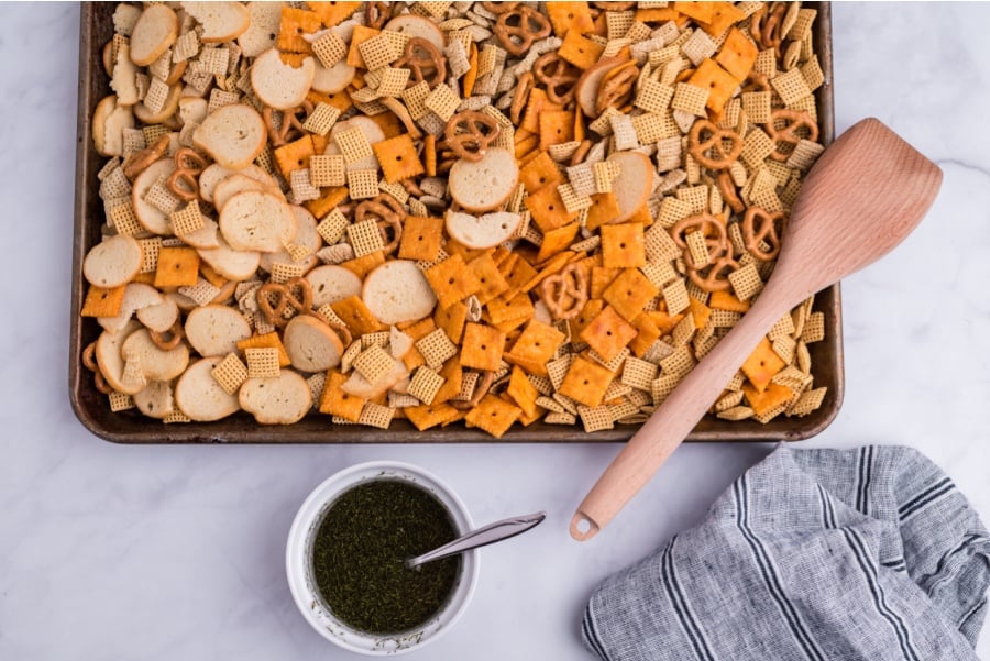 chex mix on a baking sheet