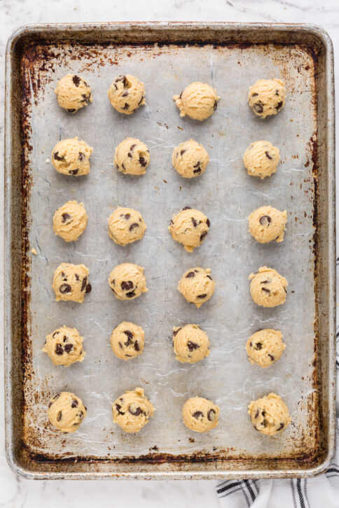 Cookie dough balls on a baking sheet