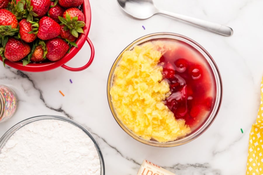 strawberry pie topping, crushed pineapple, and water in a mixing bowl