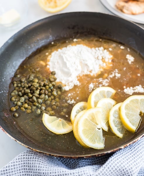 ingredients for chicken piccata in a pan