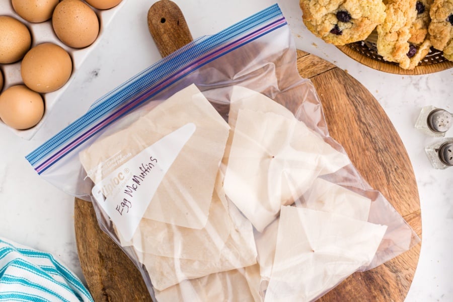 Copycat Egg McMuffins wrapped in parchment in a ziplock back