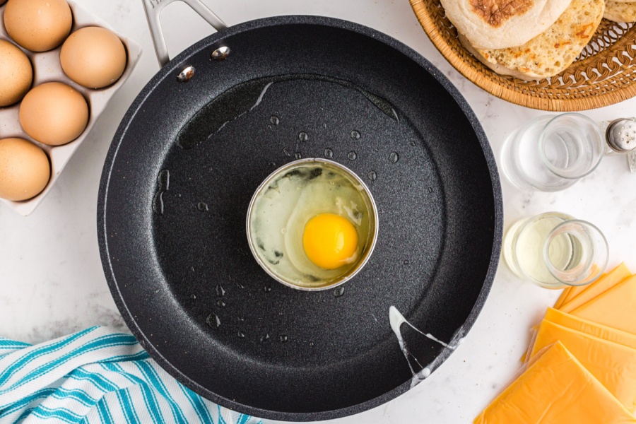 egg cracked in a biscuit circle in a pan