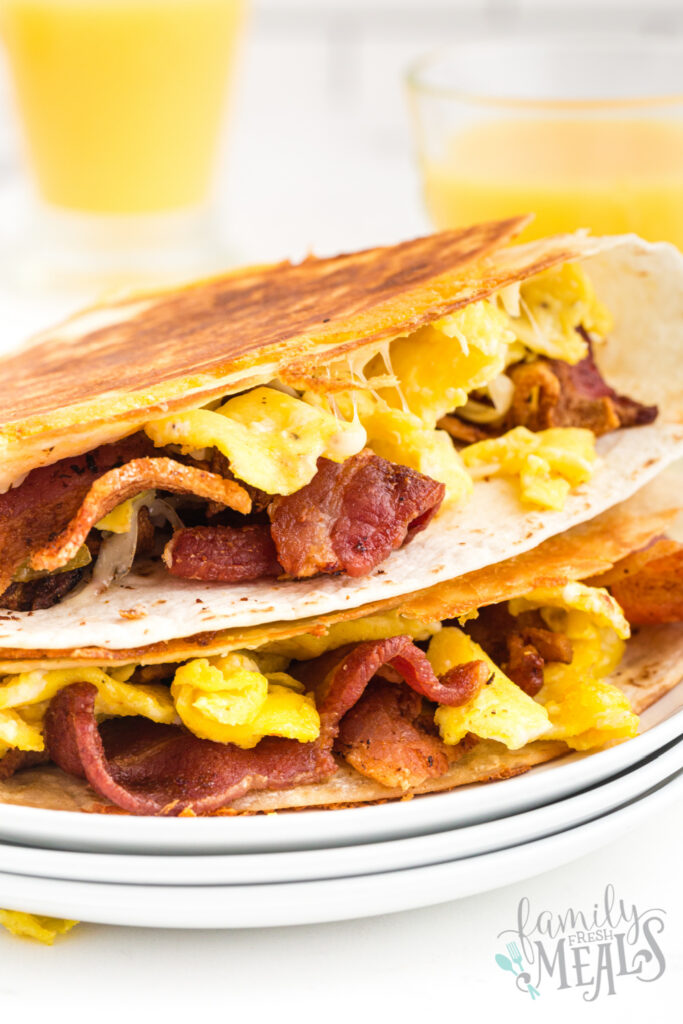 2 breakfast quesadillas stacked on a plate