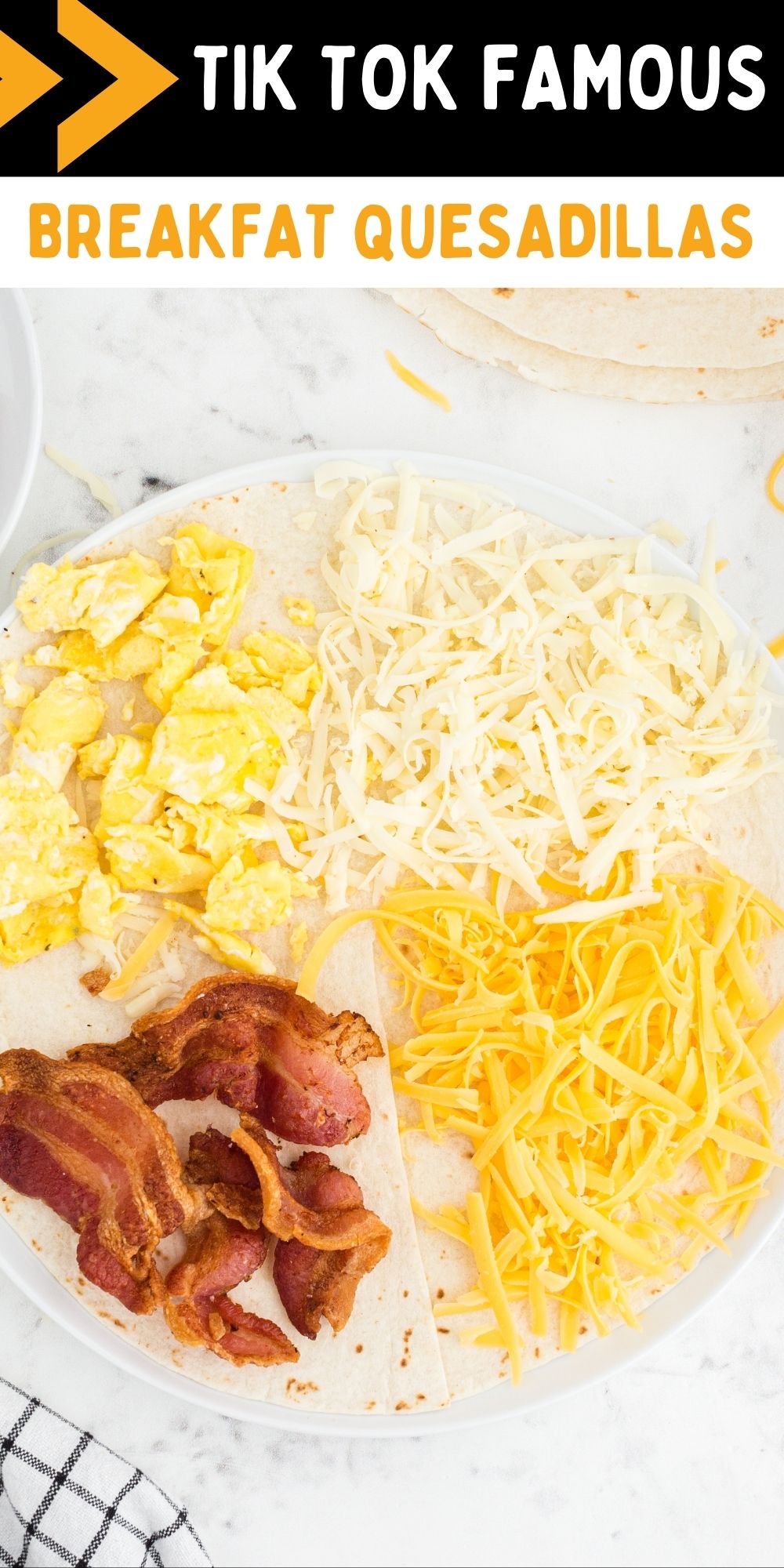 These Tik Tok Famous Breakfast Quesadillas have each quadrant of the tortilla filled with different breakfast goodies - eggs, bacon, & cheese. via @familyfresh