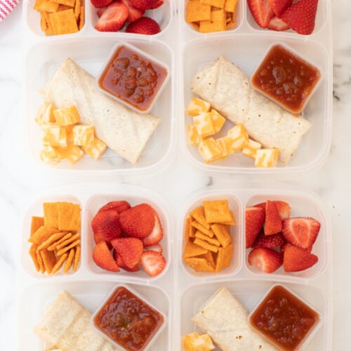 4 lunchboxes packed with burritos, strawberries, crackers, cheese and salsa-5